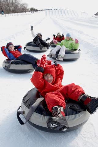 happy kids snowtubing