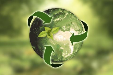World with recycling arrows over it
